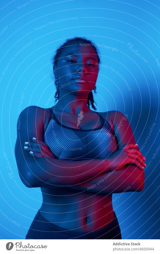 Sporty female model in activewear sportswoman portrait studio confident sporty athlete fit healthy lifestyle physical black african american lady posing