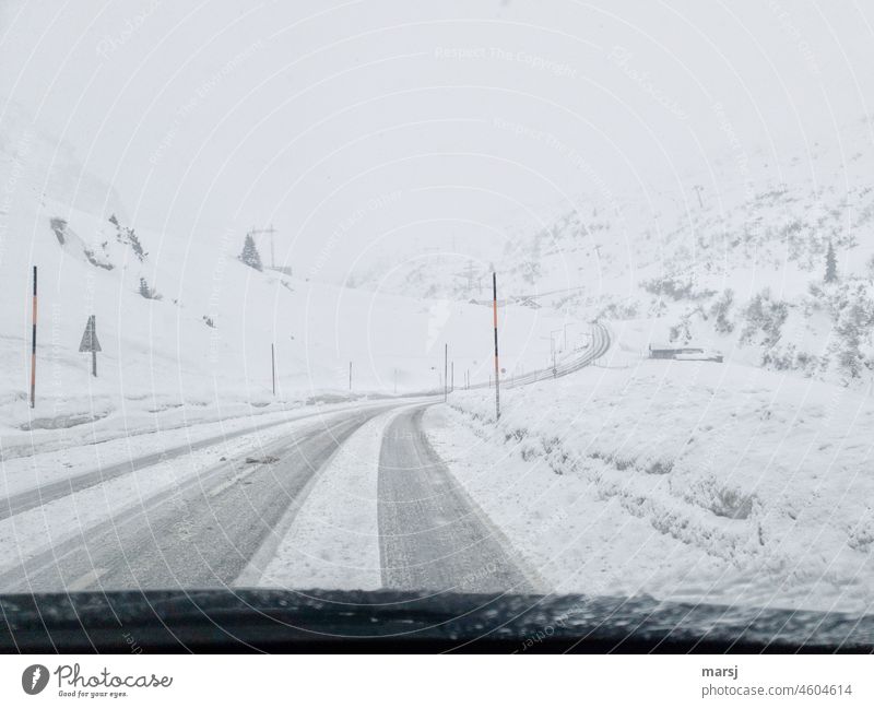 Difficult conditions over the Arlberg Pass. Snow road. Winter Street snowy road Winter vacation Cold Landscape freezing cold Vacation & Travel limited