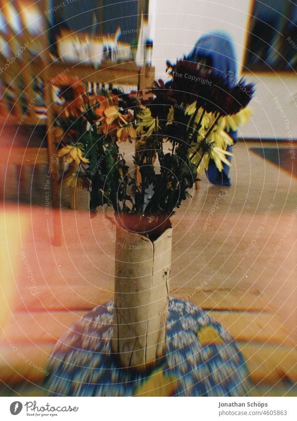 colorful bouquet in vase on table with Lightleak vintage Retro lightleak Analog Shaft of light Light leak Film Close-up Colour photo Deserted Lomography