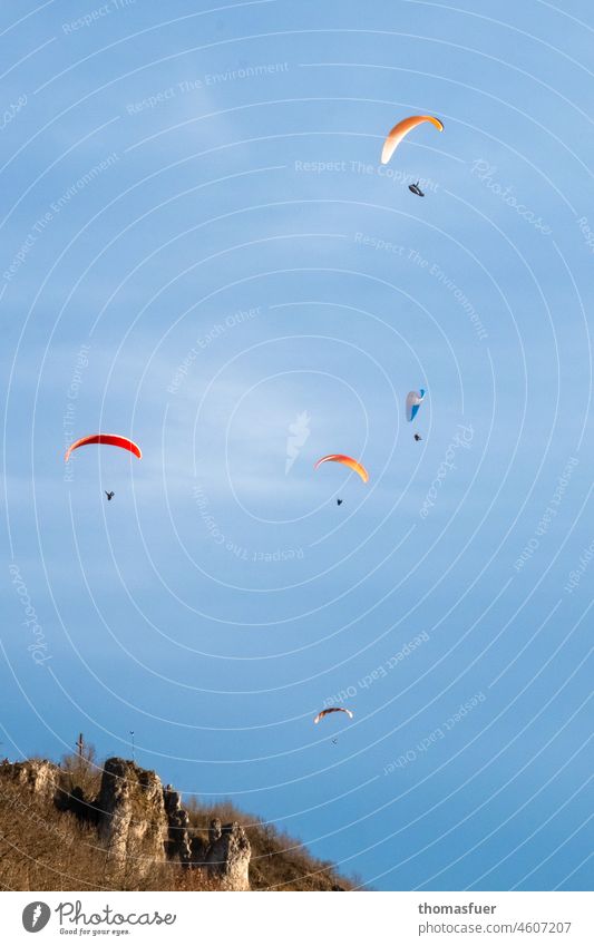 Paraglider on mountain in front of blue sky Paragliding mountains Peak Blue sky Flying Leisure and hobbies Mountain Sports Calm Freedom Nature Lifestyle