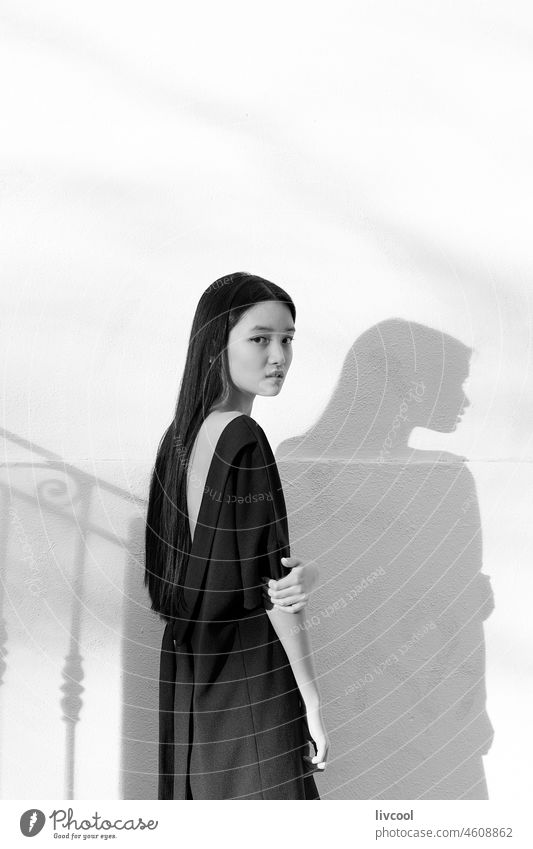 young chinese girl with blue dress II asian china teenager woman lifestyle shadow people allure cool elegance beauty portrait outdoor black and white