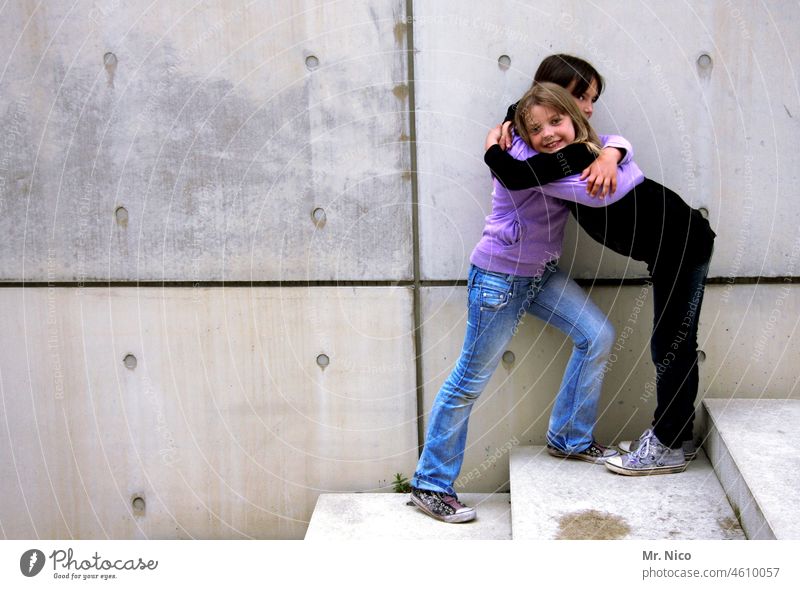 best friends Embrace hug free hugs Happy Smiling Friendship Sympathy Trust 2 8 - 13 years Girl Wall (building) Wall (barrier) Stairs stagger girlfriend