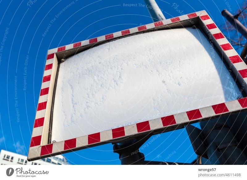 Rectangular traffic mirror covered with hoarfrost traffic mirrors rectangular red/white Hoar frost Worm's-eye view bottom view Blue sky clear Cloudless sky