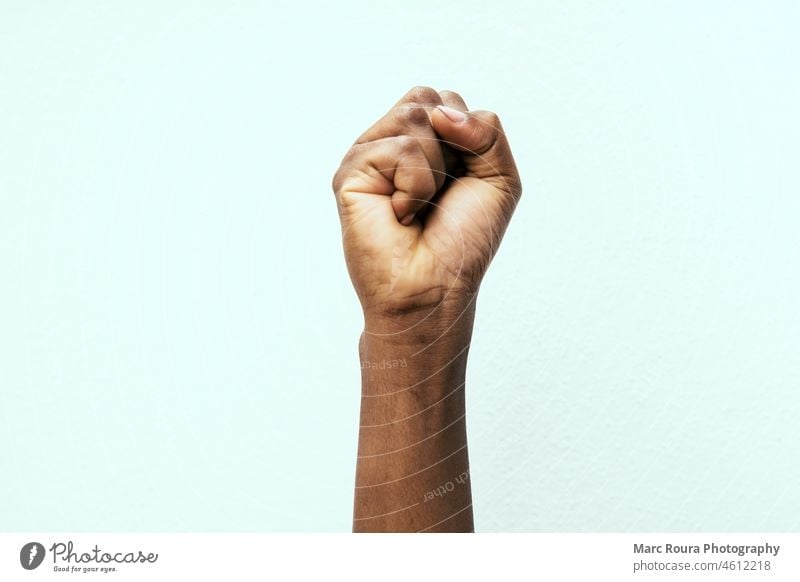 black fist in the air as a sign of power africa american african angry arm background black lives matters fist black matters body business campaign caucasian