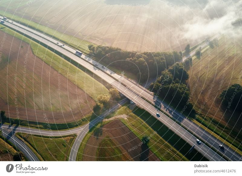 Car traffic on highway at summer day, aerial view road transport logistic car travel transportation overpass junction europe delivery intersection asphalt above
