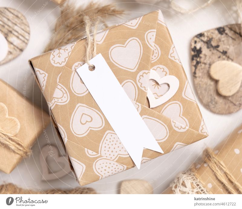 Valentines present with blank gift tag and hearts close up, Rustic label Mockup mockup wrapped beige boho rustic love paper bohemian kraft spring summer