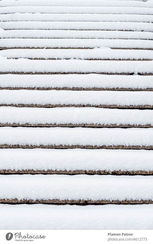Cement steps covered with freshly fallen snow. Steps not cleaned of snow, risk of slipping. abstract background cold concept cool danger day december design