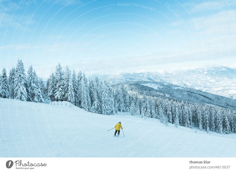 Skier on the ski slope skis Sports mountain Ski piste Yellow Blue Driving