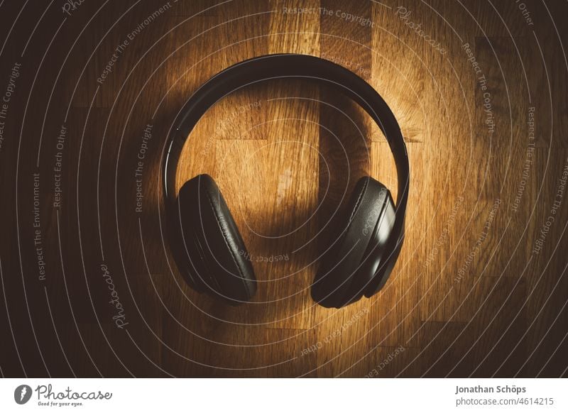 Headphone flatlay on wood texture bass plan headphones Wood Wood texture Wooden table Headphones Volume Light minimalism Music Music streaming On Ear Podcast