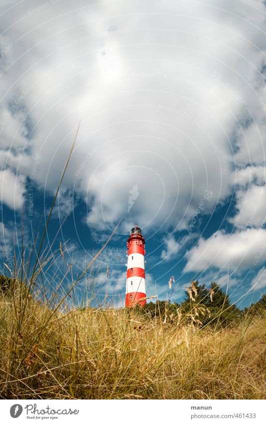 shining tower Nature Landscape Clouds North Sea Island Lighthouse Manmade structures Tourist Attraction Vacation & Travel Colour photo Exterior shot Deserted