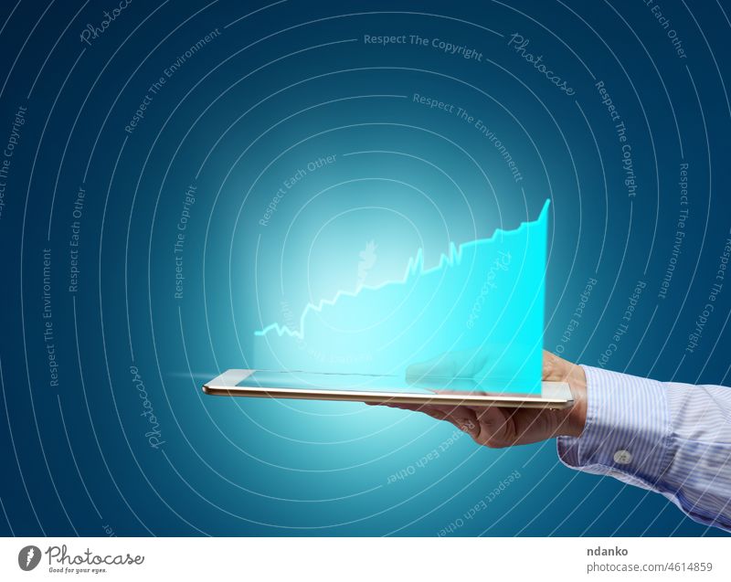 female hand holding electronic tablet with holographic graphic on blue background analysis analyzing arm arrow benefit business chart concept datum development