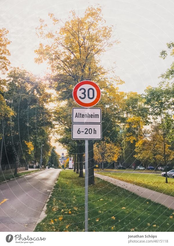 Street sign zone 30 at old people's home street sign Old people's home Nursing home care age nurse High-maintenance obsolescence grandma grandpa Meadow Footpath