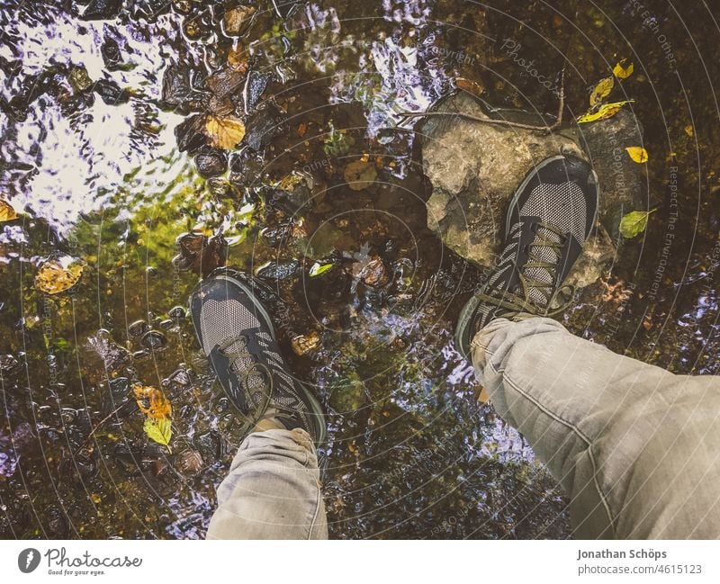 cross a stream with hiking boots Traverse Crossing Brook Hiking boots Footwear First person view hike outdoor evening tax River Wet Water Watertight Pants