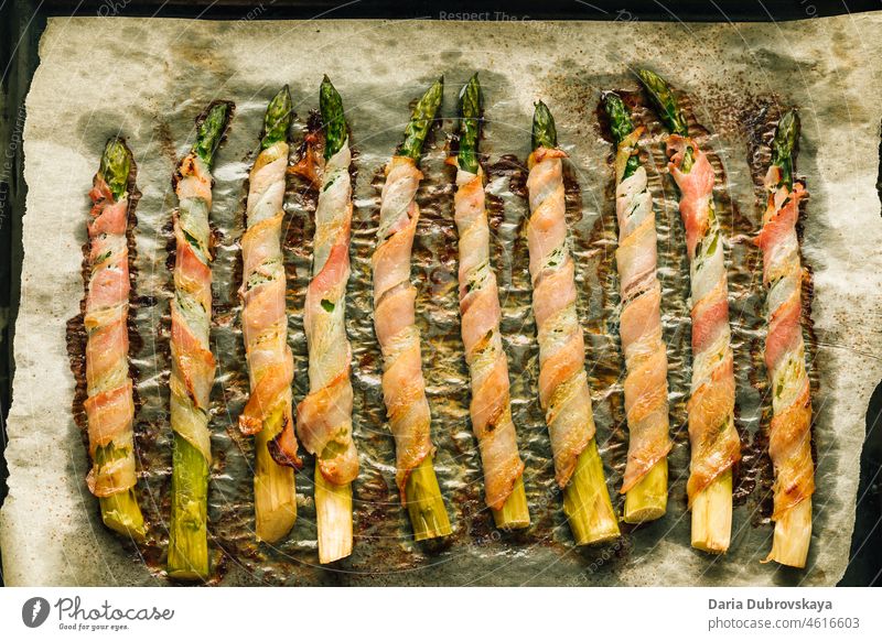Asparagus baked in bacon grilled prepared party picnic lunch gourmet tasty healthy closeup crispy snack pork green italian dinner food fried meal mediterranean