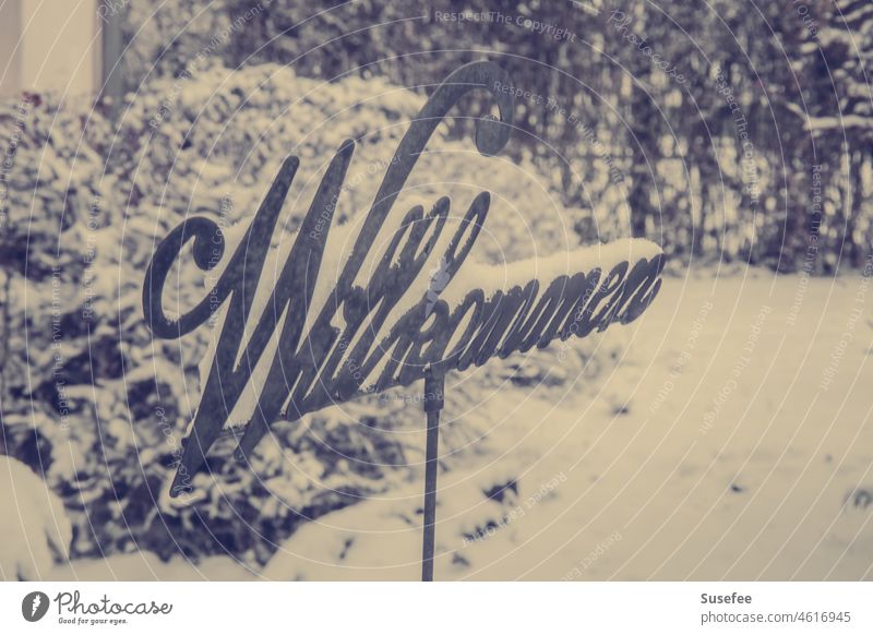 Snowy metal "Welcome" sign in garden Winter Garden Sign Nature Deserted Cold warm Season