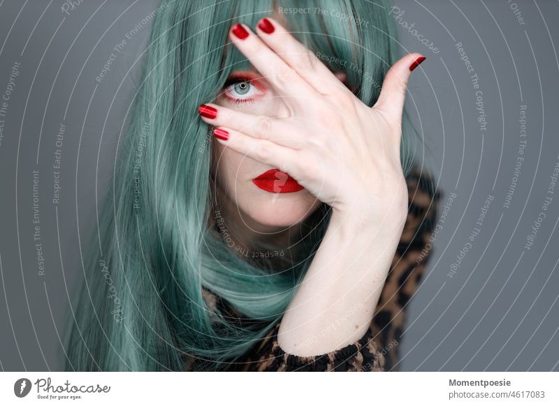 transparency Green green-haired creatively Creativity Hide Observe look red nails Red red lips pretty stylish Modern Hip & trendy urban Easygoing Cool youthful