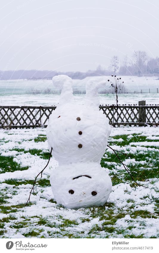 Snowman stands on his head. Winter Cold Funny Head Handstand White Infancy Seasons Smiling Happy Nature Exterior shot Frost Happiness reverse Joy Playing Frozen