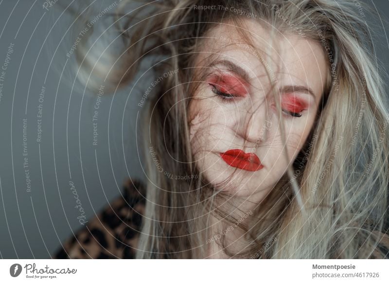 blonde woman with red makeup and blonde long hair Blonde Human being Face portrait Hair and hairstyles Wind pretty Feminine 18 - 30 years Face of a woman Red