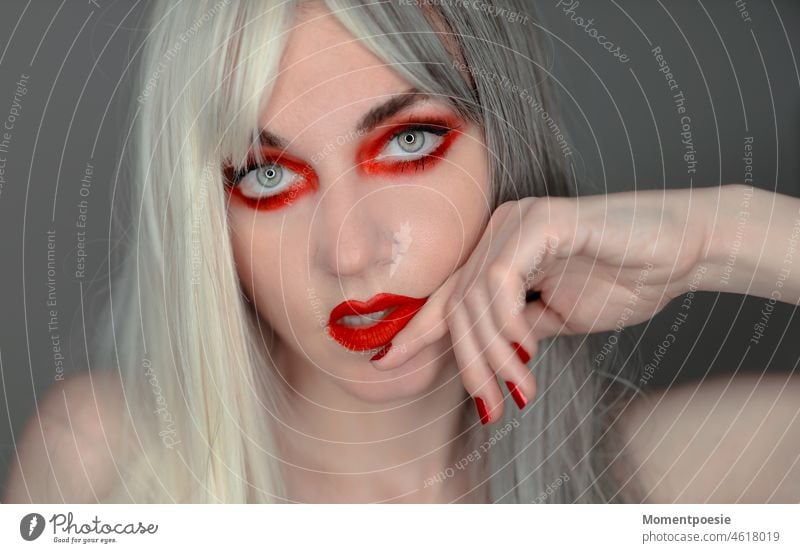red made up woman with white and gray hair White Red Gray Gray-haired youthful White-haired Blonde Hair colour hairstyle pretty Woman Face Make-up red nails