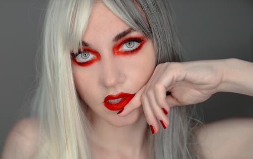 red made up woman with white and gray hair White Red Gray Gray-haired youthful White-haired Blonde Hair colour hairstyle pretty Woman Face Make-up red nails