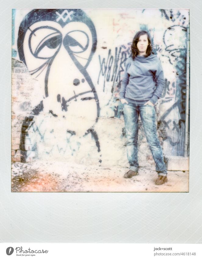 self-confident she draws the eye Polaroid Young woman 18 - 30 years Street art Graffiti Posture Sweater jeans Easygoing naturalness Lifestyle Model pretty