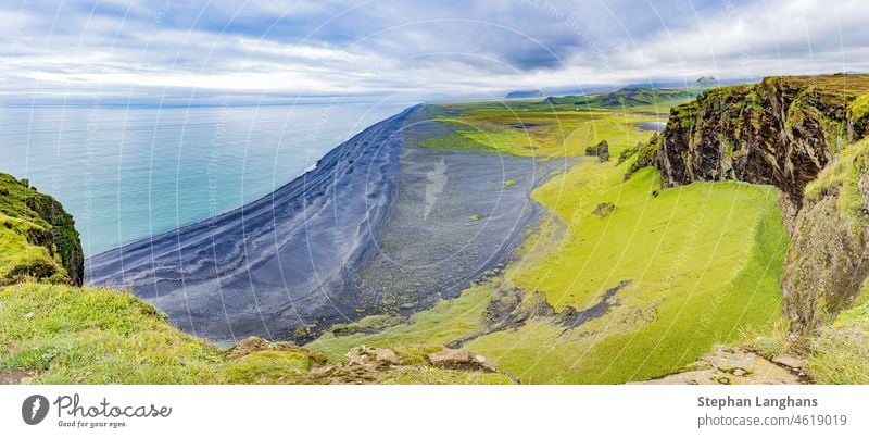 Panoramic picture of black Reynisfjara beach from Dyrholaey outlook in southern Iceland southern iceland golden ring rock coast landscape ocean icelandic travel