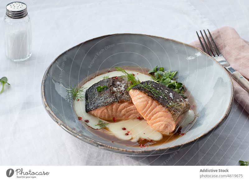 Salmon with mashed potatoes with seasonings on ceramic plate salmon fillet lunch fish omega 3 tasty grilled dinner nutritious mediterranean food cream sauce