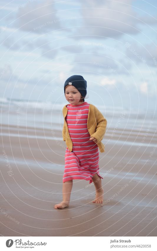 little girl with cap running barefoot on beach Beach Ocean idyllically fantastically beautiful Clouds Sky Waves Barefoot Walking Running Movement move Dress