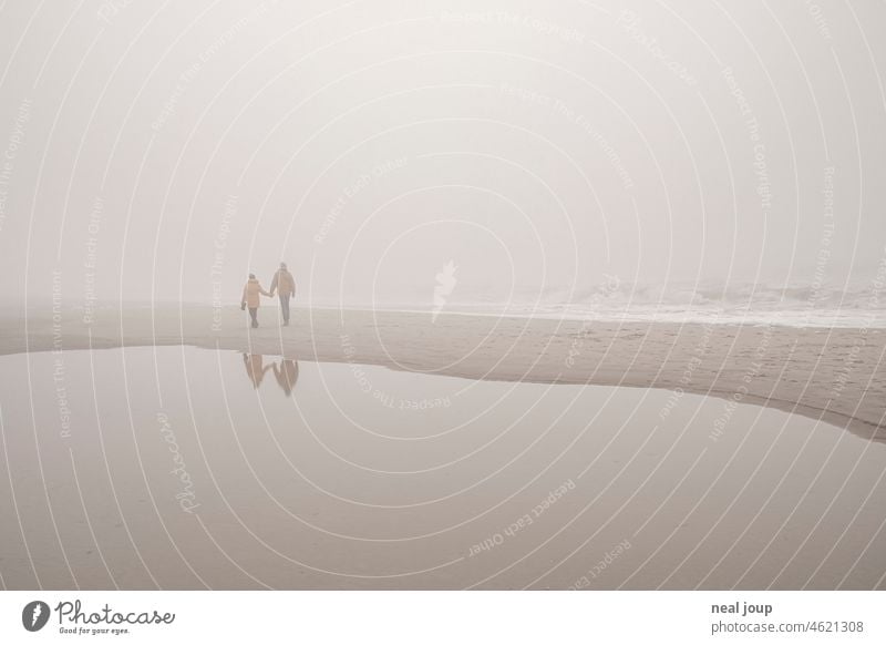 Couple walking hand in hand on a foggy beach. All sorts of things. Ocean Beach coast Fog Monochrome romantic poetry Nature Landscape Exterior shot Relaxation