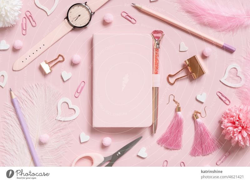 Hardcover notebook, Pink school girly accessories and hearts on pastel pink Top view, mockup education stationery textbook Girly feminine romantic watch