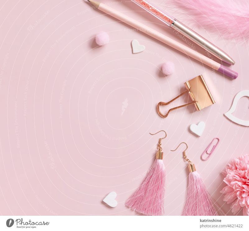 Pink school girly accessories and hearts on pastel pink Top view valentine love education stationery feminine romantic pencils flowers. paperclips