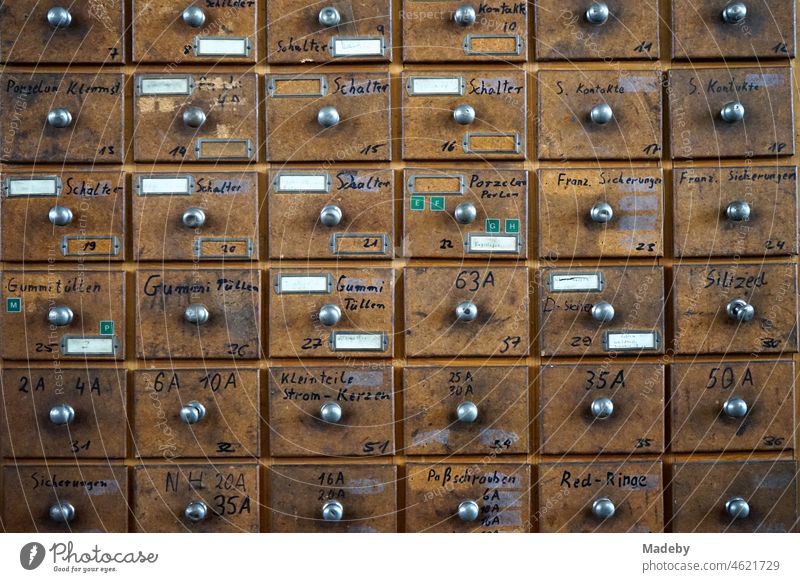 Old wooden cabinet with many drawers for small parts in the warehouse of a former factory building in the district of Margaretenhütte in Giessen on the Lahn River in Hesse, Germany