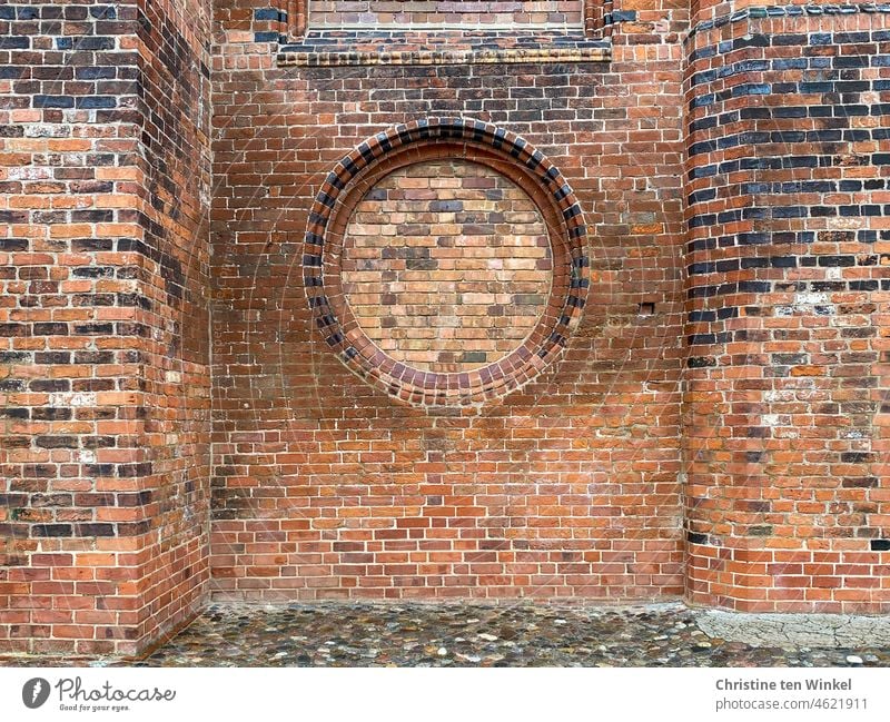 Old brick facade of a church with bricked up round window Brick facade Brick wall Wall (building) Wall (barrier) Facade Bricks repaired Red Stone