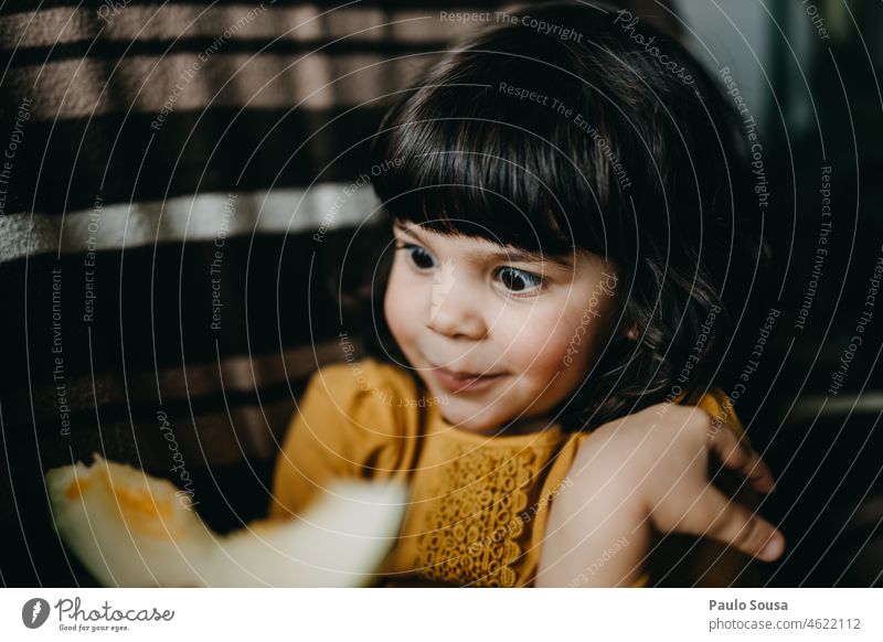 Portrait of cute girl Girl 3 - 8 years Caucasian Child childhood Looking Melone slice Fruit Fresh Appetite Day Joy Lifestyle Human being Eating Healthy