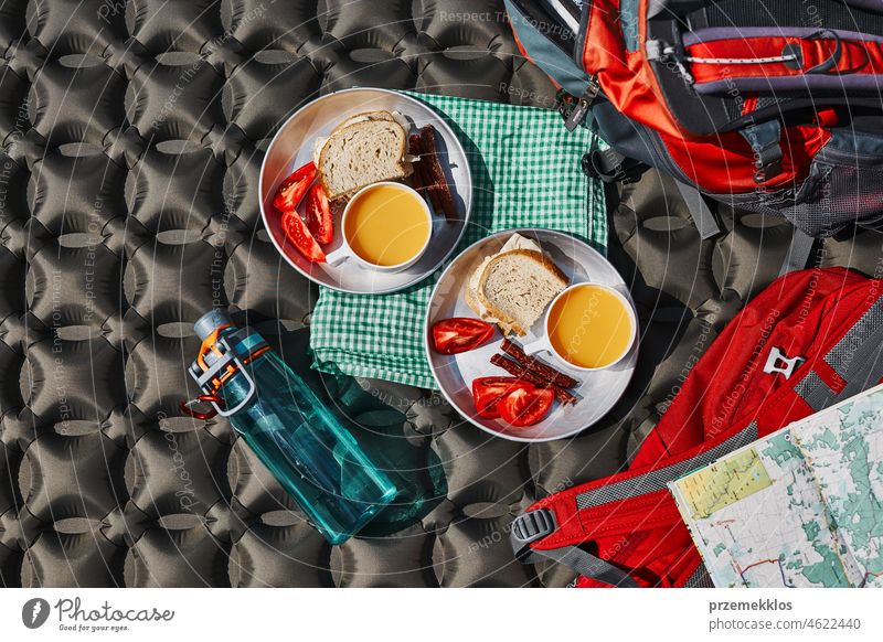 Breakfast at camping outdoors. Plates with sandwiches on outdoor mat breakfast food tent vacation trip adventure campsite traveling active recreation equipment