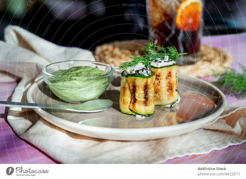 Tasty zucchini rolls on plate stuffed dish serve cuisine meal filling food puree dill table cheese tasty delicious appetizing yummy fresh nutrition culinary