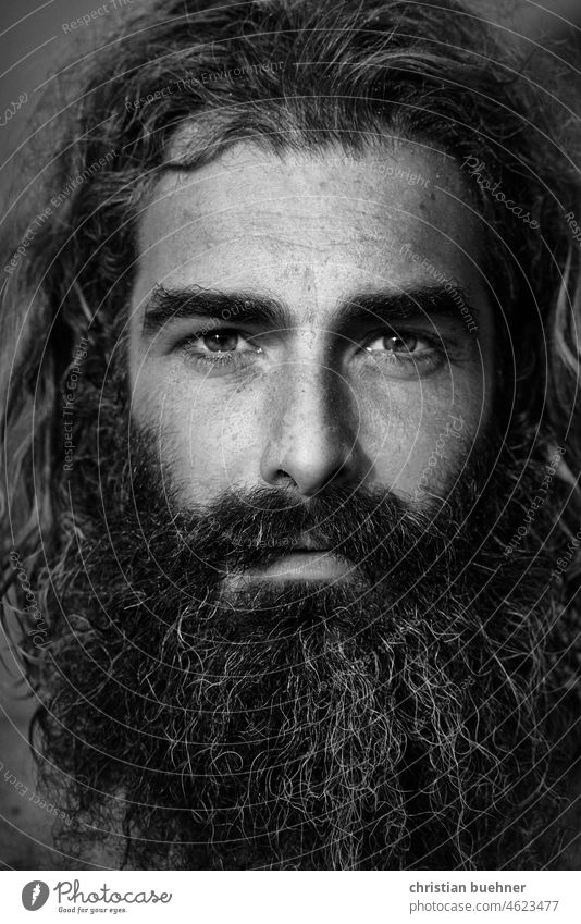 portrait of a long haired hippie with intense eyes Man long hairs 40 years Guru Intensive outstanding black and white Mystic Strong Hypnotic Robinson Crusoe