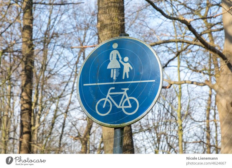 street sign pedestrian and bicycle white isolated road blue background zone lane symbol only path way walk traffic warning ride bike route caution footpath