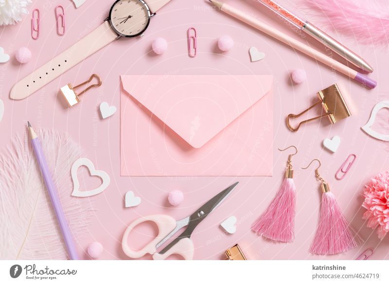 Pink envelope, school girly accessories and hearts on pastel pink top view, mockup education valentine stationery love romantic message feminine pompoms