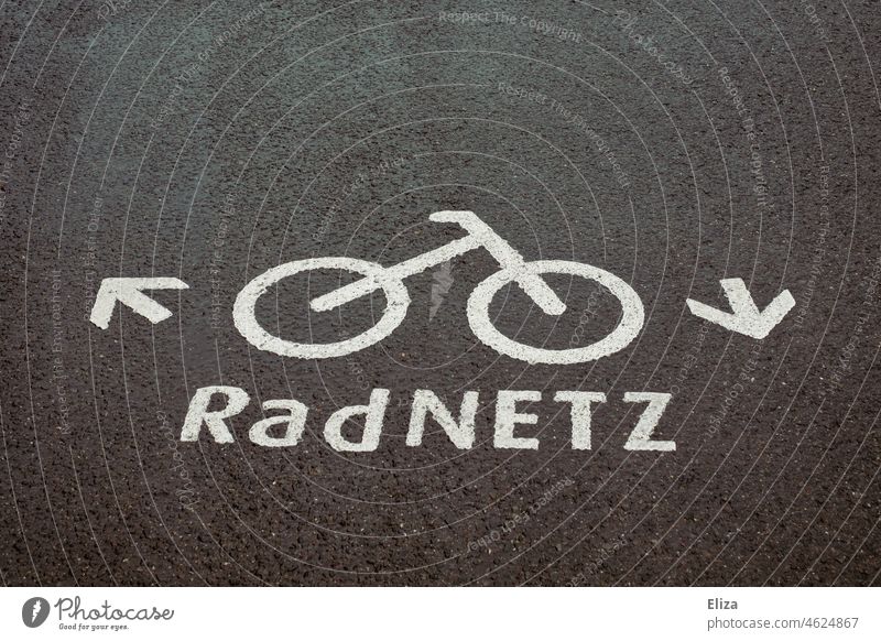 Signposted bicycle network with bicycle symbol on asphalt. Bicycle lane. Cycle path bike net Street Asphalt Lane markings Cycling cycle path