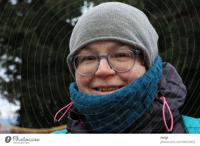 wrapped up warmly - portrait of smiling woman with glasses, scarf and cap in nature Human being Woman Head Face Eyeglasses Cap Scarf Winter chill Exterior shot