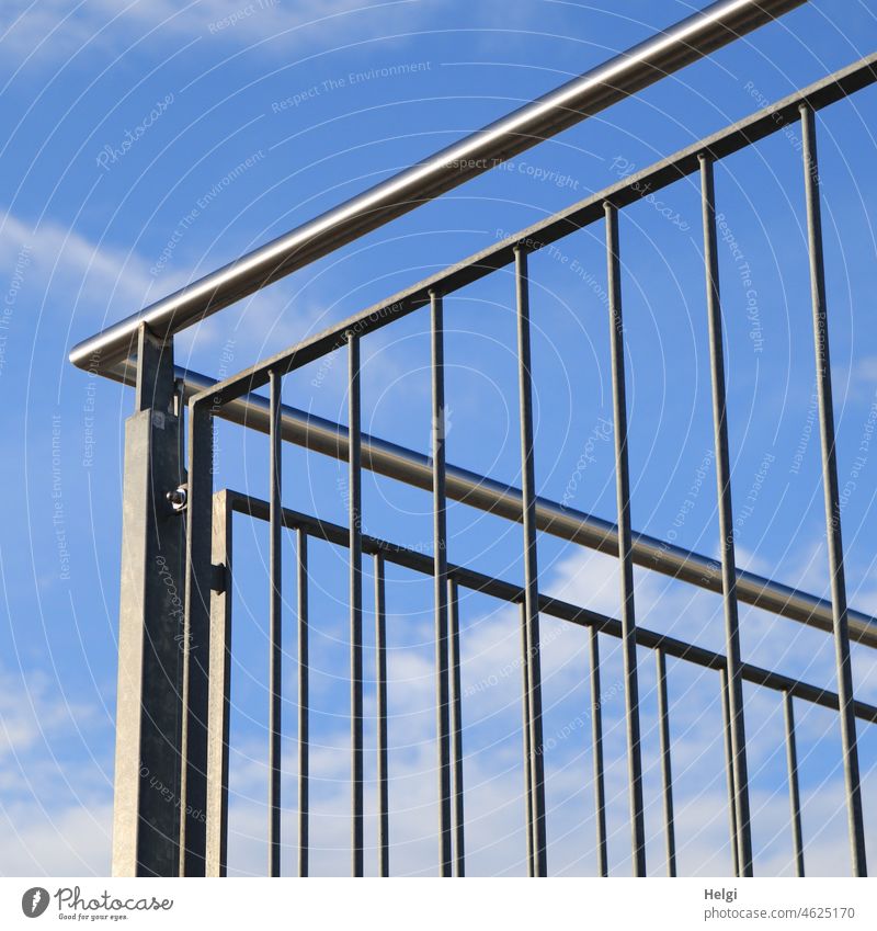 Metal railing against blue sky with clouds Protection peril Sky Blue Clouds White metal rods handrail Direct obliquely perpendicular Deserted Exterior shot