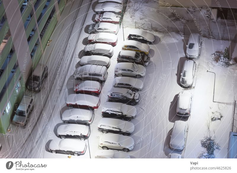 Cars on night winter parking lots car snow vehicle road aerial weather many parking car parking lot night parking lot cars above aerial view snowy ice