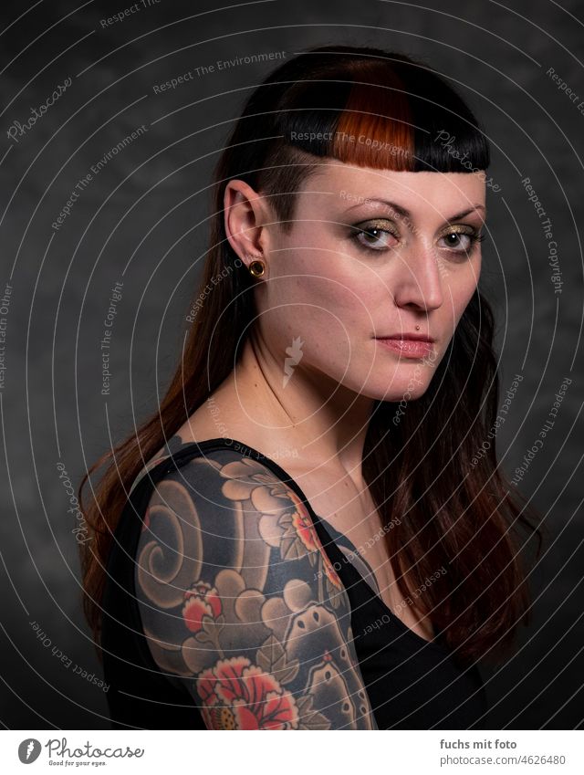 Beautiful woman with tattoo - a Royalty Free Stock Photo from Photocase