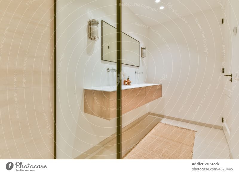 Interior of bathroom with shower cabin style interior sink washroom hygiene sanitary mirror design ceramic light glass transparent wall washbasin clean