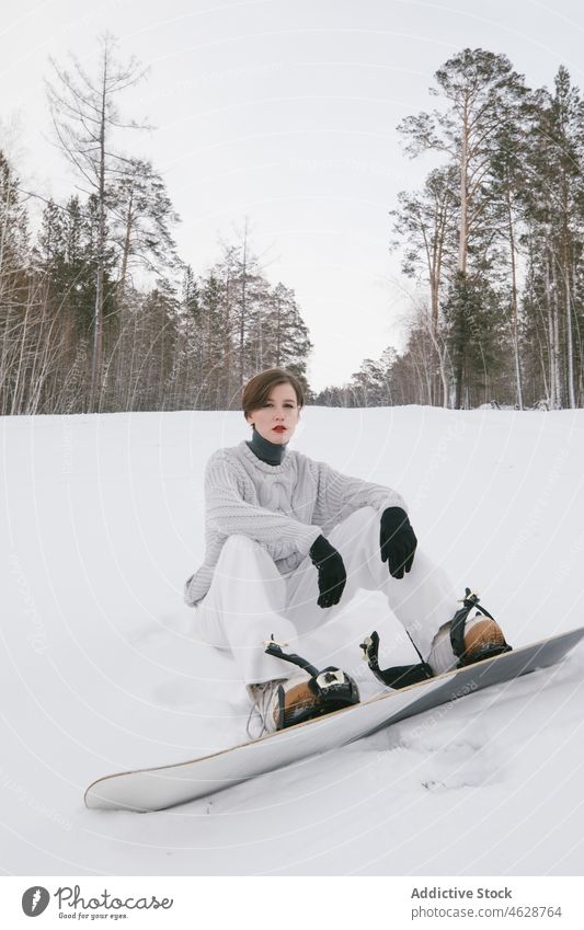 Young girl with a snowboard action alluring boarder cool courage emotions excitement extreme fashion model fashionable free freestyle glamor glove gorgeous