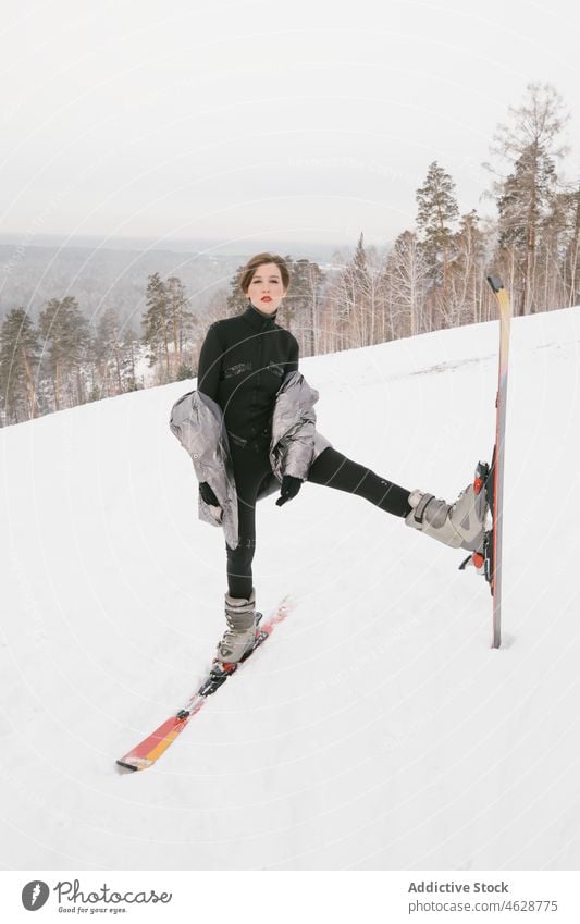 Young girl with skis action alluring boarder cool courage emotions excitement extreme fashion model fashionable free freestyle glamor glove gorgeous