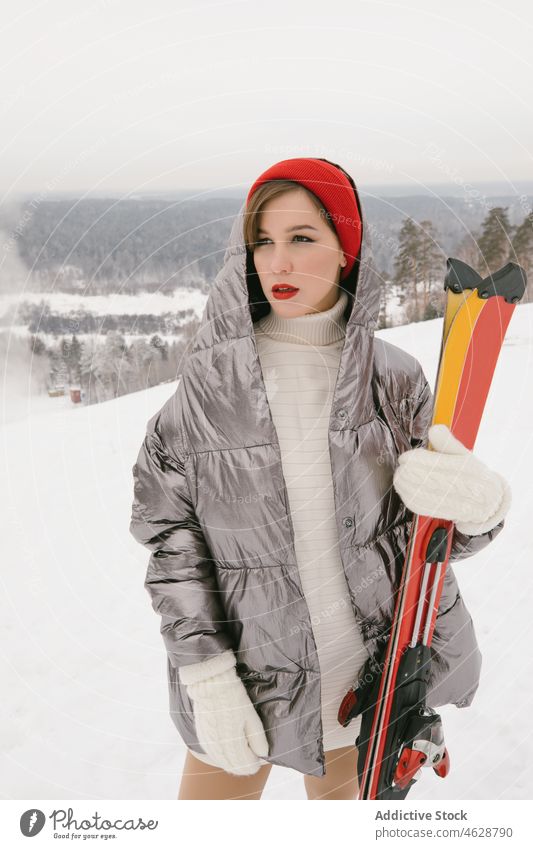 Young girl with skis action alluring boarder cool courage emotions excitement extreme fashion model fashionable free freestyle glamor glove gorgeous