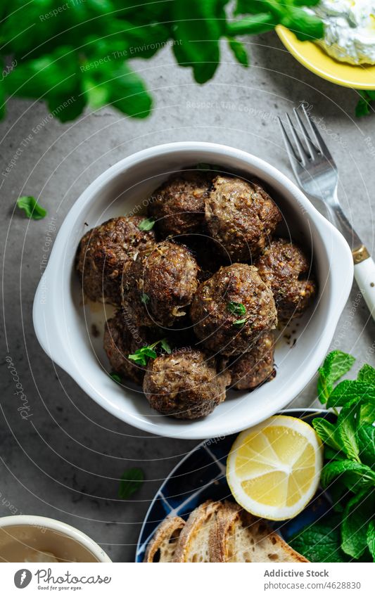 Tasty keftethes in bowl on table meat traditional greek dish cuisine culinary meatball food meal delicious tasty serve palatable lunch delectable kitchen yummy