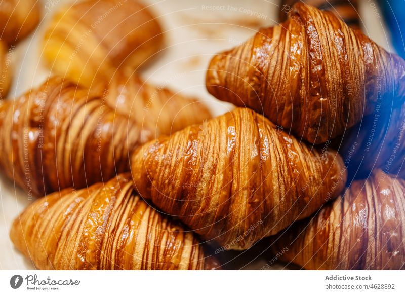 Delicious croissants in showcase of confectionery pastry sweet dessert culinary calorie bakery treat food gastronomy delicious tasty parchment yummy flavor fork